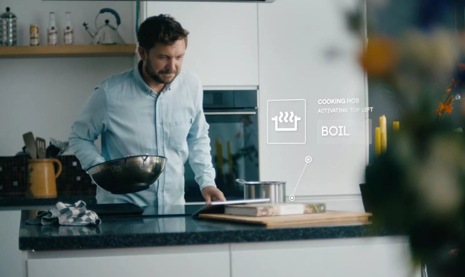 Husband is being helped with cooking with connected appliance